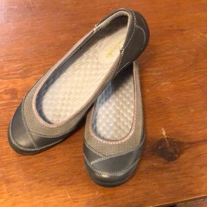 Clark women’s size 9.5 shoes.  Never worn, flat slip-on style.